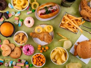 Unhealthy lifestyle triggers that worsen PCOS, such as junk food and lack of exercise