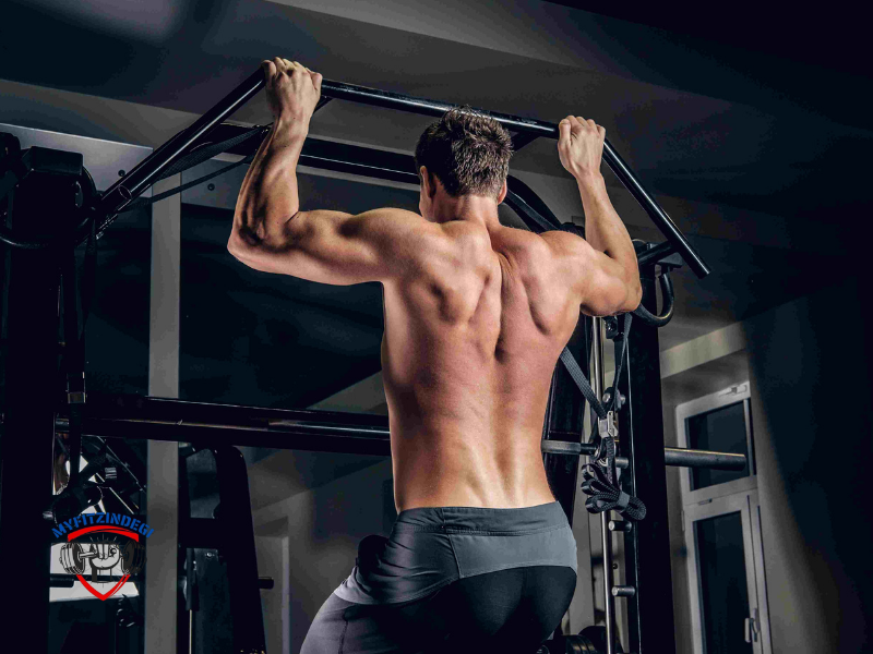 Man doing pull-ups on gym bar for back workout
