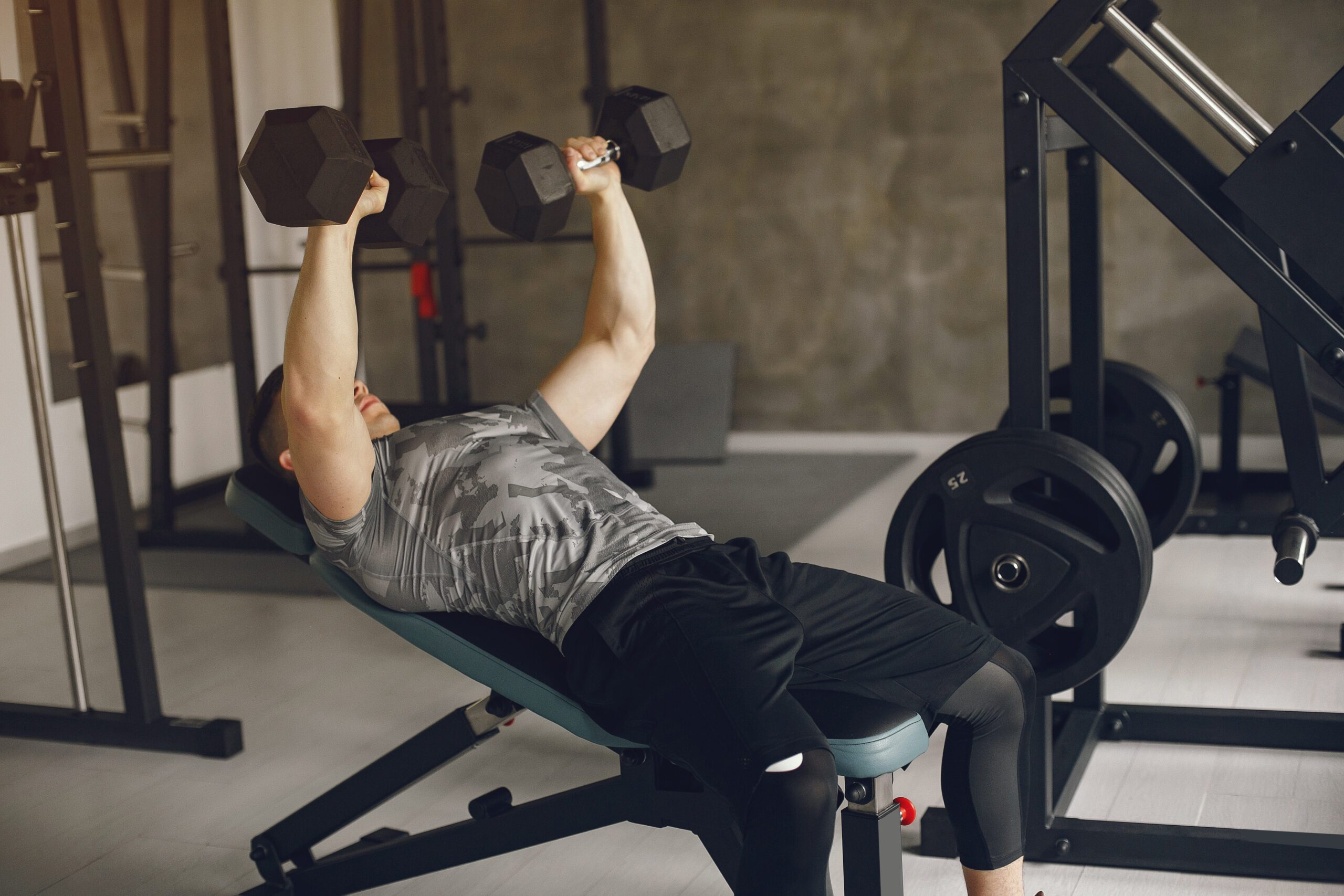 Incline dumbbell press targeting upper chest muscles